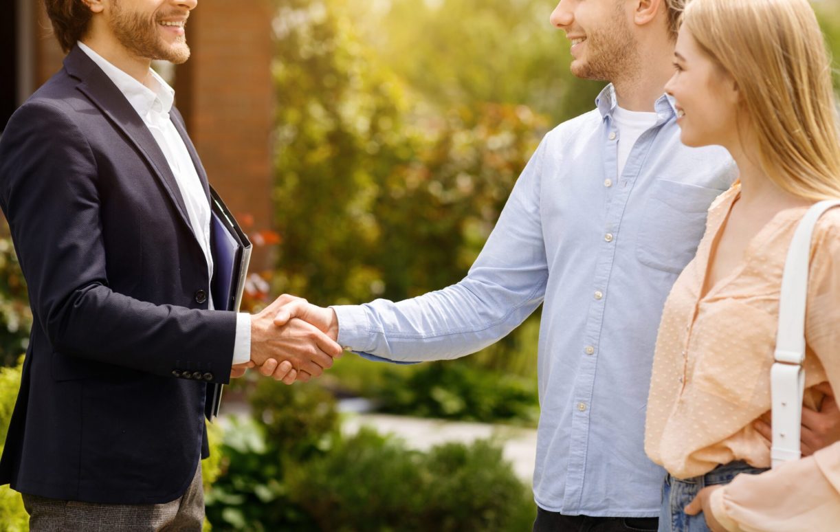 Cropped,View,Of,Real,Estate,Broker,Shaking,Hands,With,His